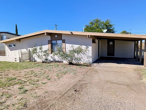 Front of the house with carport