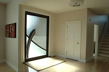 Stunning entry with custom designed door.