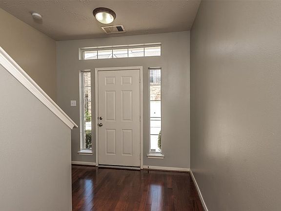 Front entrance with side light front door; laminate floors and plenty of room for entrance furniture.