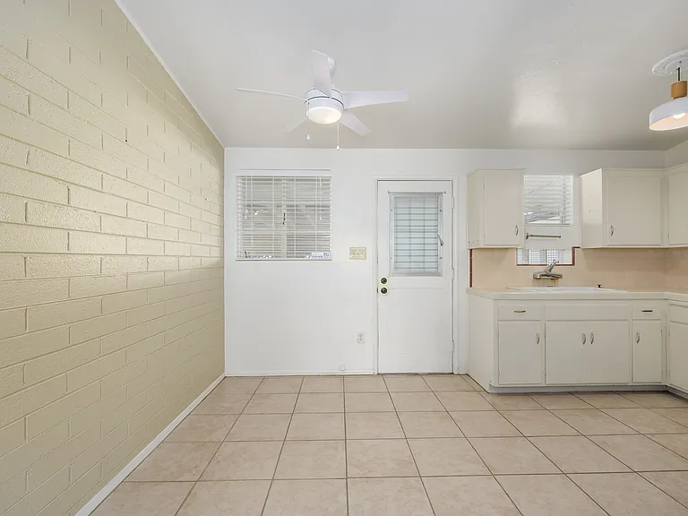 Dining area, back door (carport entry door) and kitchen