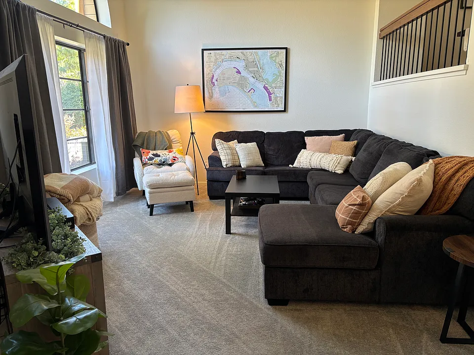 This is alternate view of living room with different furnishing.
