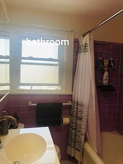 Full bathroom with vanity and medicine cabinet storage.