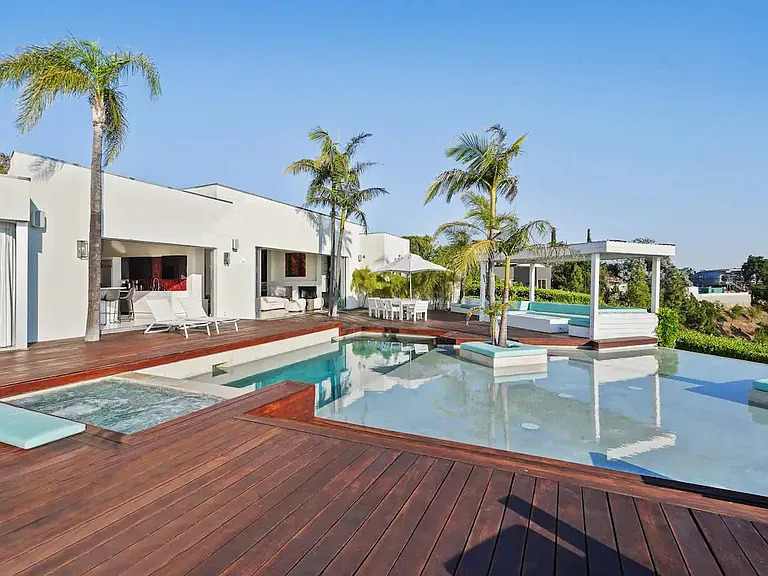 The outdoor deck offers ample space for entertaining, creating a welcoming setting for gatherings and making cherished memories.