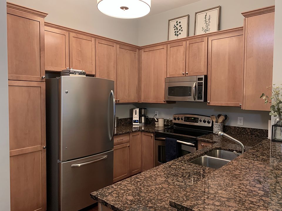 Kitchen with everything you need, including refrigerator and freezer, oven, stove, microwave, and dishwasher