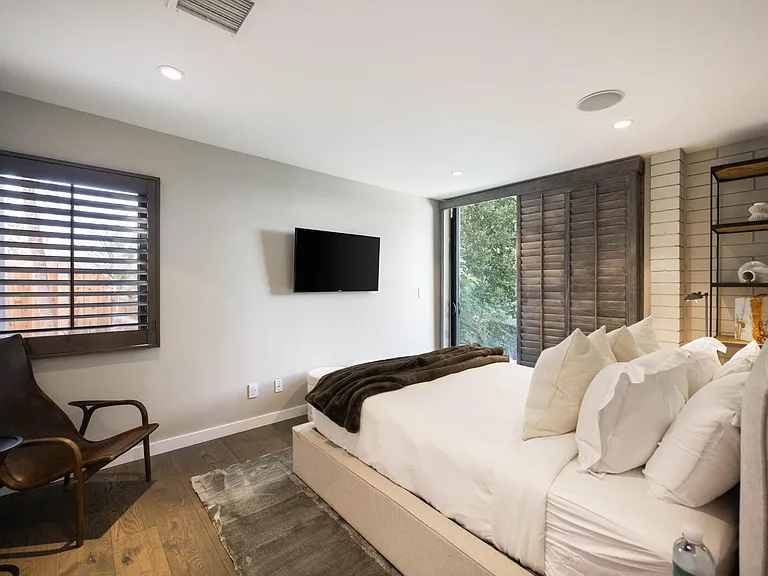Discover artistic design elements adorning the bedroom.