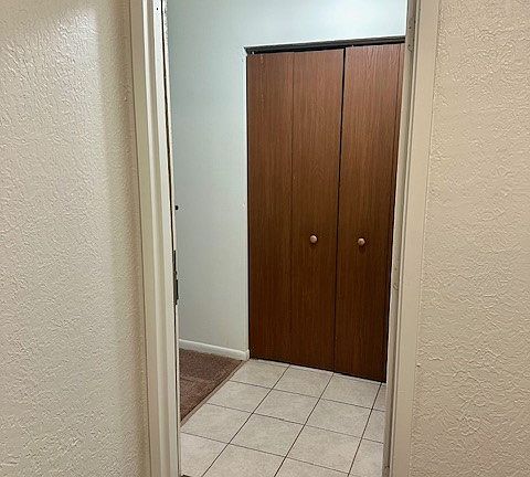 Entering into 2205 E from building hallway- coat closet doors