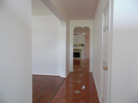 What an amazing foyer with keystone accents. Fresh paint and archways.