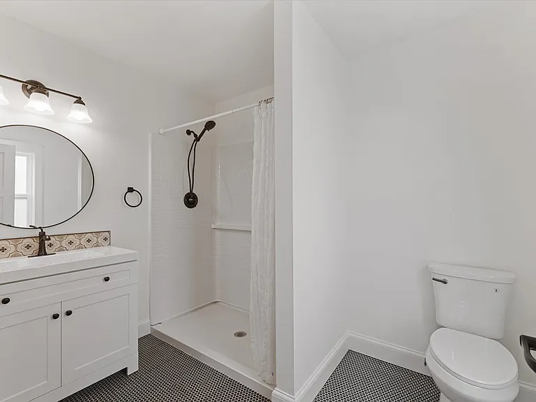 3/4 bath on main off fam rm / primary suite.
