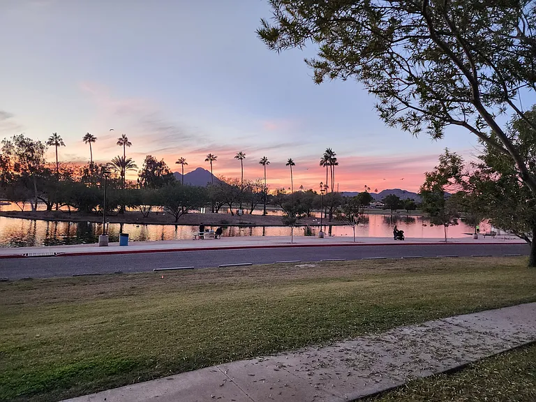 Sunset view over Chaparral lake with. Camelback mountain.