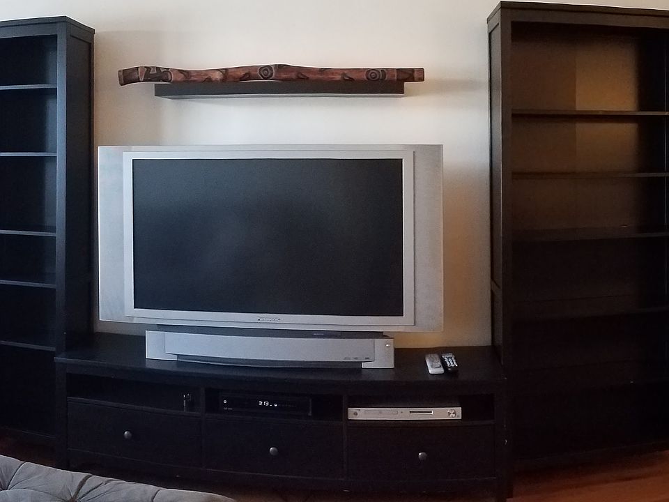 Spacious lving room features sectional couch and 2nd couch.