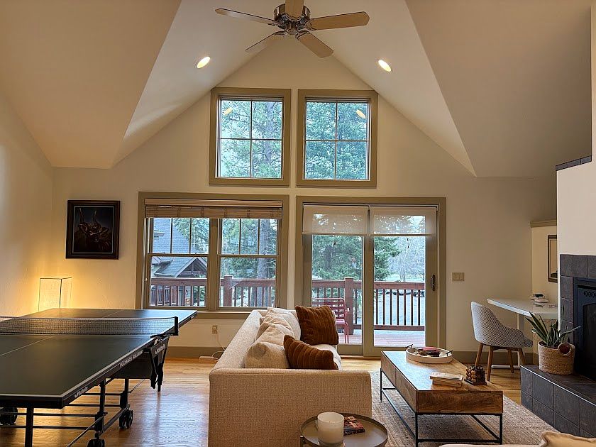 High ceiling open space living room with ping pong table