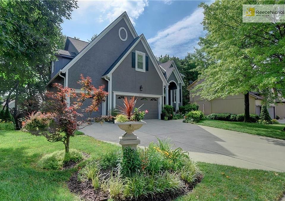 Curb appeal at it's finest! New exterior paint, gorgeous landscape and mature trees welcome you home!