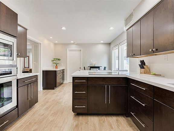 GOURMET kitchen with Craftmaid cabinets, Quartz countertops and stainless steel, LG appliances . Enjoy cooking on the INDUCTION cooktop, or the CONVECTION oven.