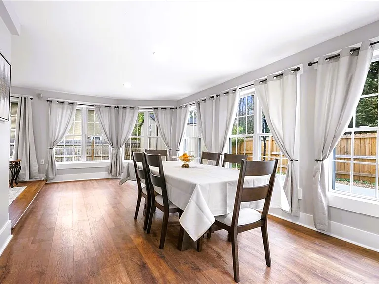 Beautiful & bright dining area in the main level sunroom
