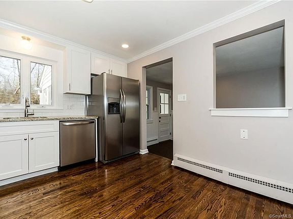 New kitchen with entry into mud room area between kitchen and garage.