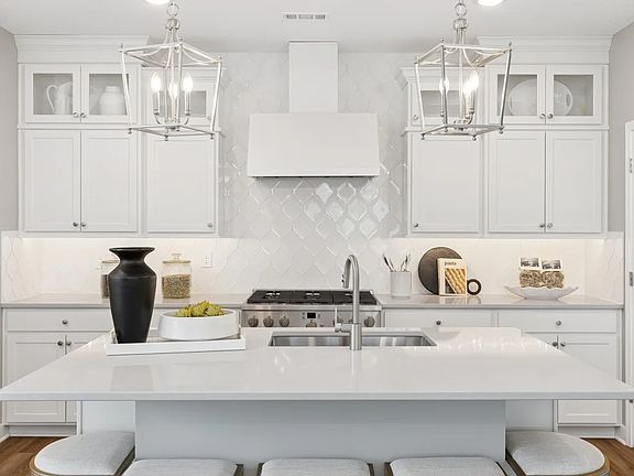Kitchen with quartz island countertops
