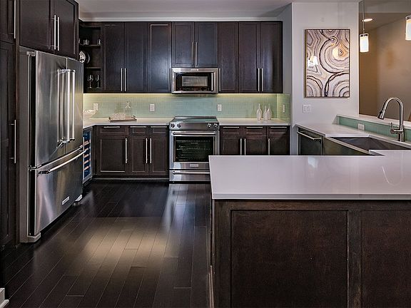 Elegant quartz countertops with waterfall edge