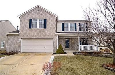 10148 Split Rock Way has a nice elevation with brick, covered porch and upgraded landscaping.