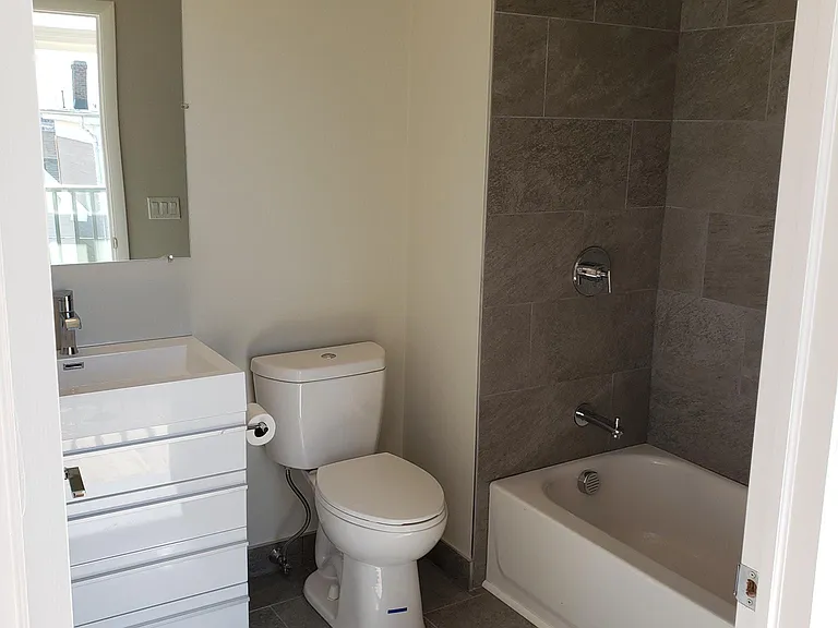 Full guest bathroom with large vanity (current photo).