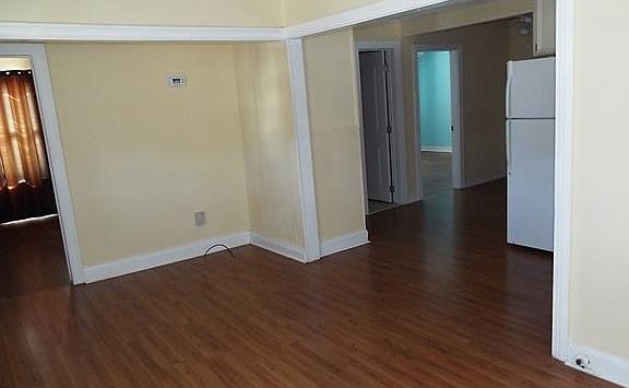 LIVING AREA W/ WOOD FLOORS & CEILING FAN