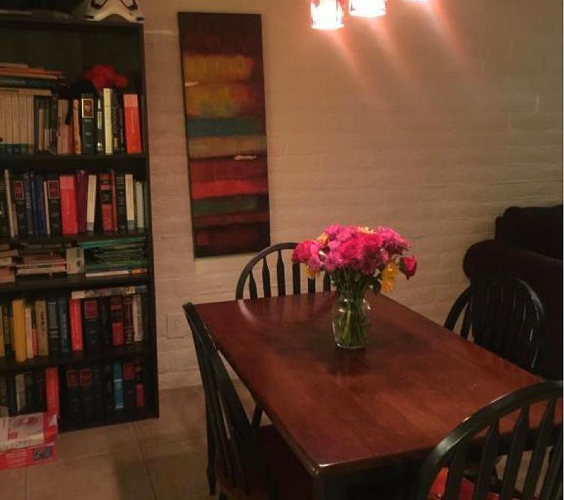 Ground floor dining area has a passthrough window to the kitchen. Dining and living room area are open plan for light and comfort.