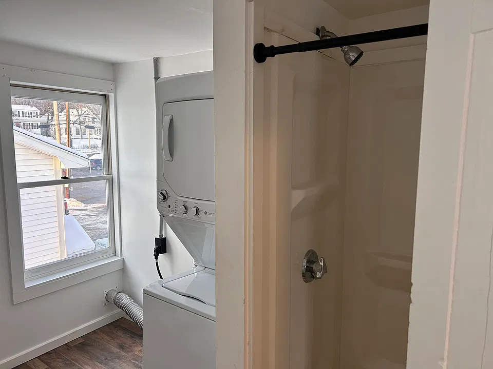 In-unit laundry in bathroom.