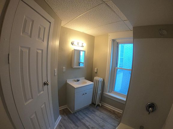 Bathroom - renovated with new tub / shower, toilet, vanity, and flooring