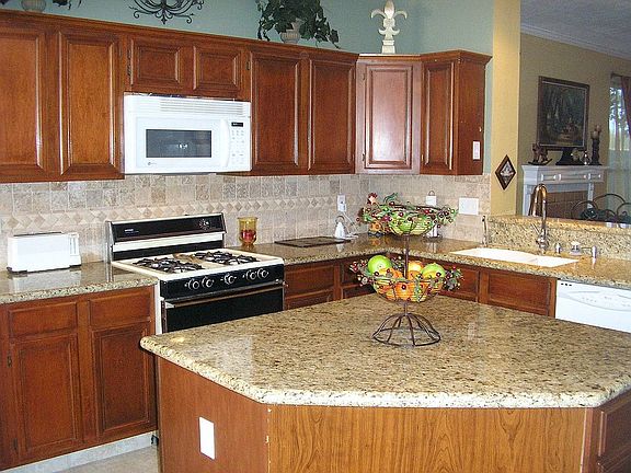 Kitchen with island and granite countertops