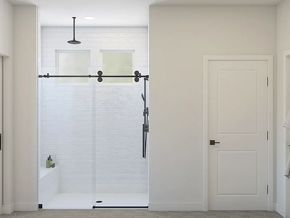 Primary bath with glass shower enclosure
