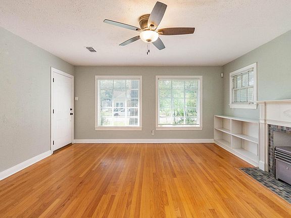 front entry and living area. built-ins on either side of fire place.