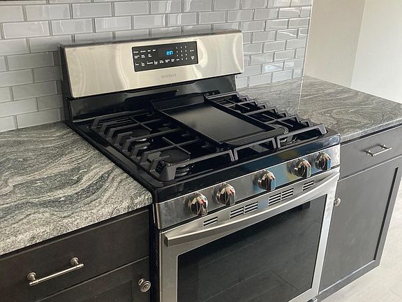 Stainless steel gas range/oven and microwave