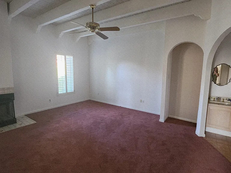 Primary Bedroom also had plantation shutters and fan.