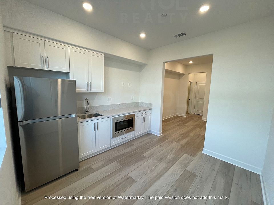 Kitchenette/living room in ground floor suite with private entrance