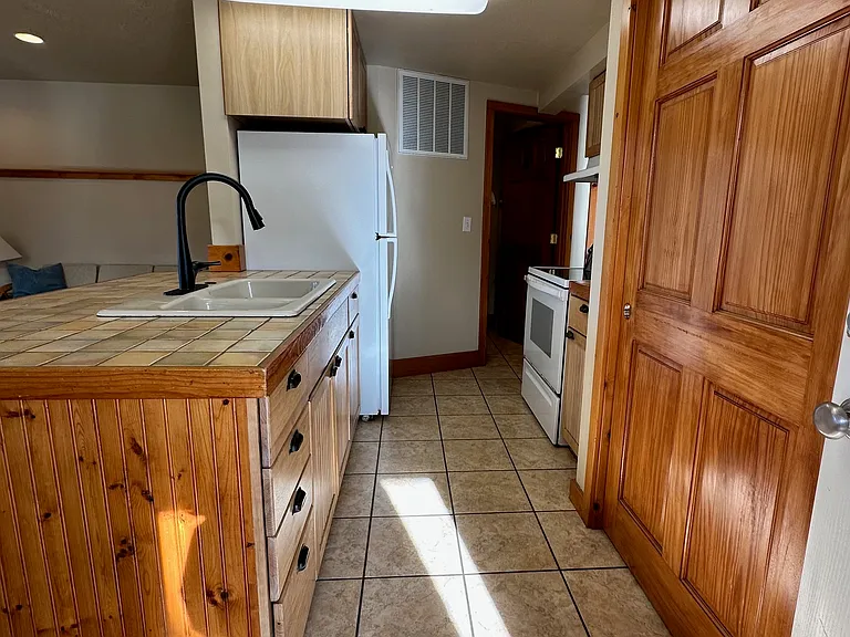 Kitchen view toward laundry room