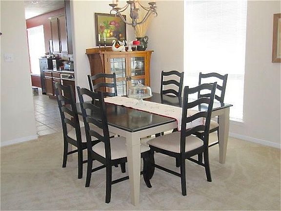 The formal dining room is conveniently located off the kitchen and the on the right as you enter the home.  It is a light and bright spot to gather while enjoying a tasty meal.