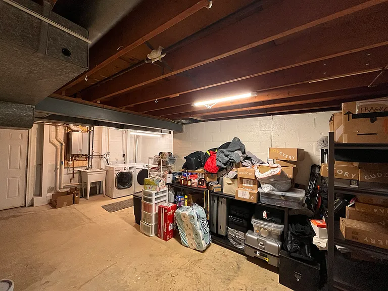 one half of the basement with laundry and storage space. walk out to backyard