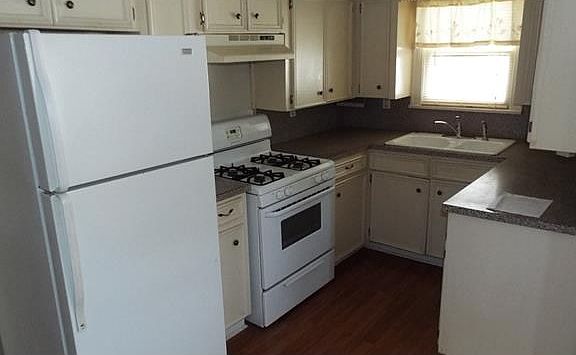 GAS STOVE, REFRIGERATOR, IN KITCHEN