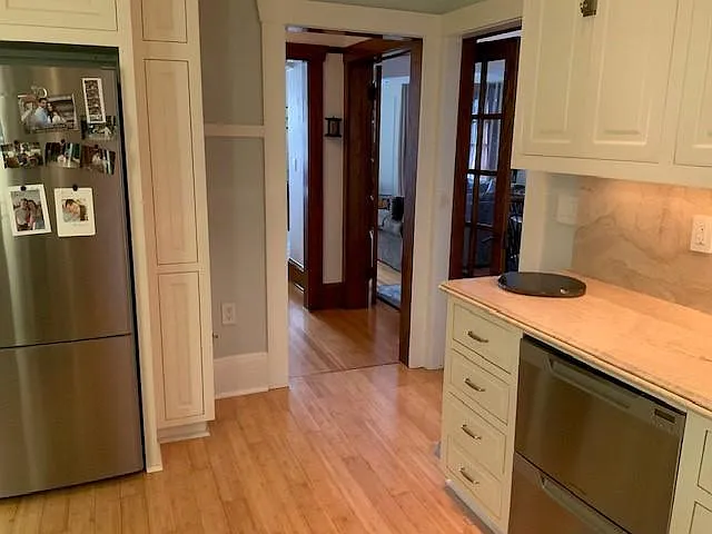 Full sized stainless steel refrigerator and double dishwasher
