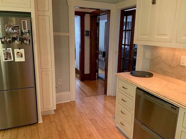 Full sized stainless steel refrigerator and double dishwasher