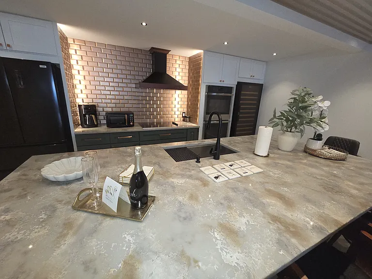 Designer decor enhances the beauty and elegance of the kitchen island.