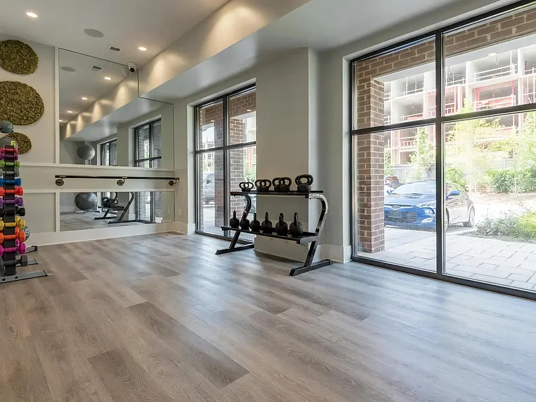 Open Exercise Space with Natural Light and Strength Equipment