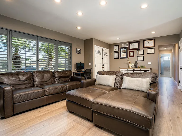Another angle of the living room with view of neighborhood.