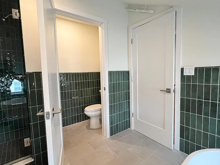 Deluxe Bath with soaking tub, walk in shower, double vanity and water closet.