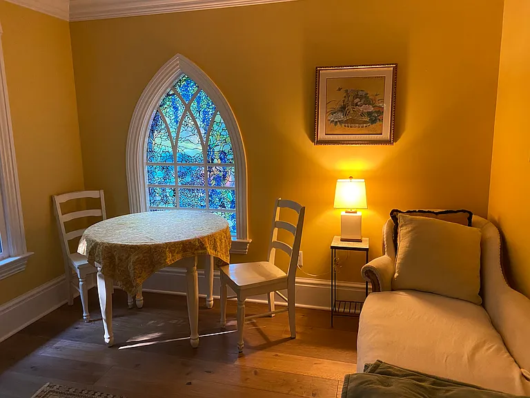 Sitting/work area ensuite with gold bedroom.