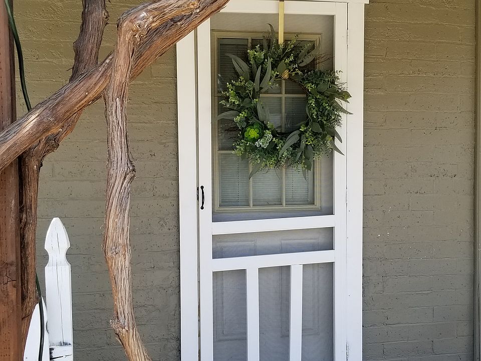 Covered Entry with grapevine over trellis
