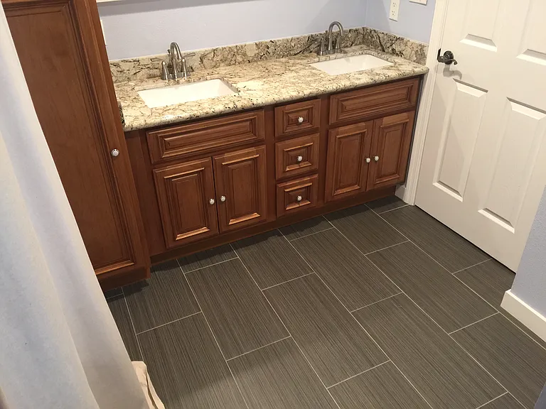 Bathroom 1 - two sinks with granite countertops and plenty of cabinet space.