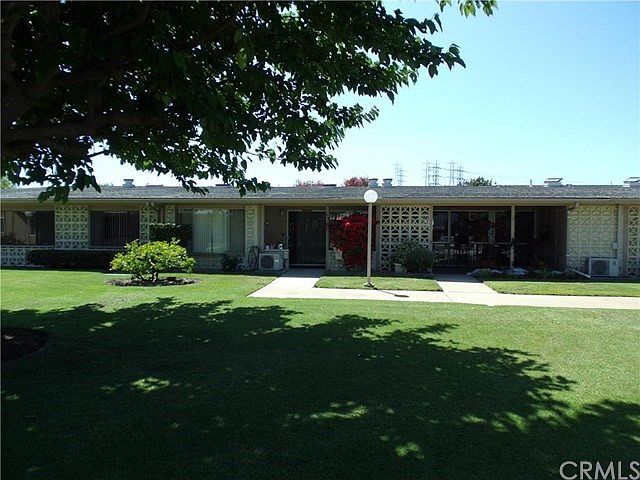 Greenbelt setting with large shade tree make this property very desirable