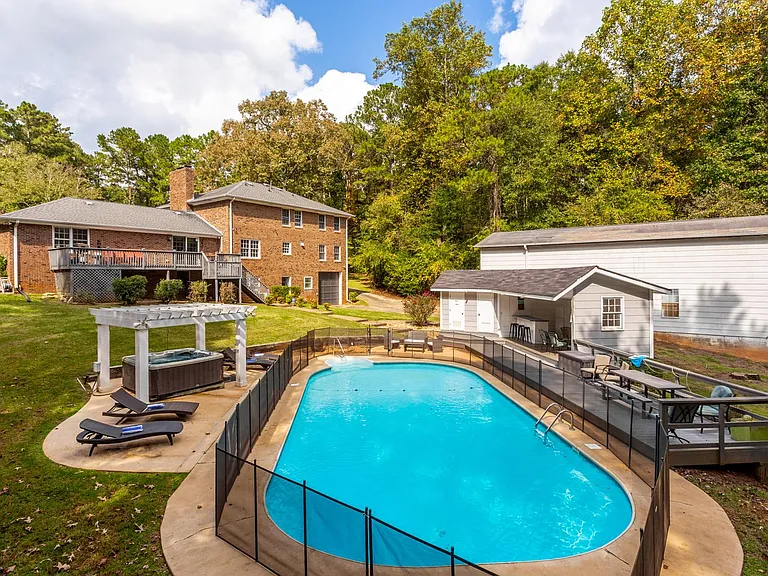 Pool ONLY OPEN May - September, HotTub open ALL YEAR. (Lounge chairs, pool bathroom, pool kitchen sink only usable/open in summer pool season.) Pool fence for safety around all year.
