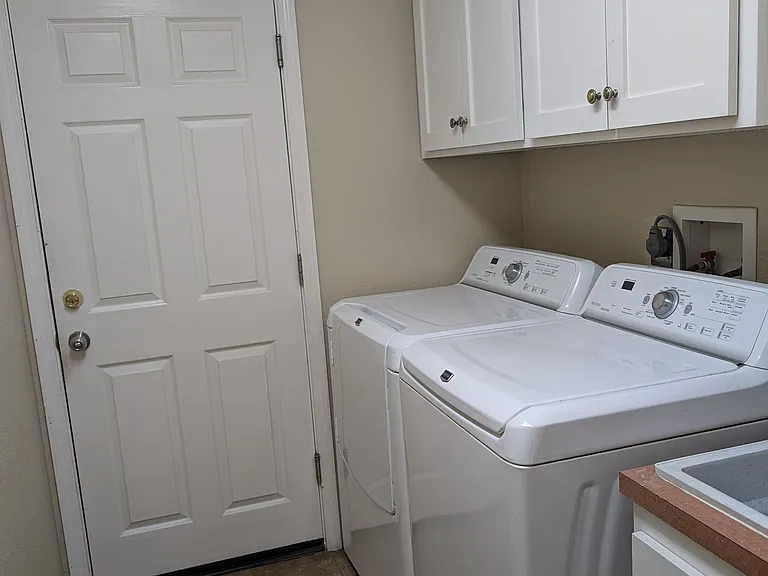 Laundry room with included washer and dryer