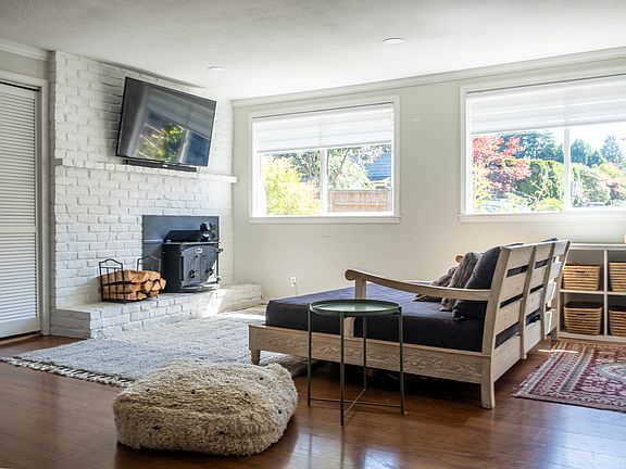 Living room with wood burning stove for staying warm & cozy throughout the winter